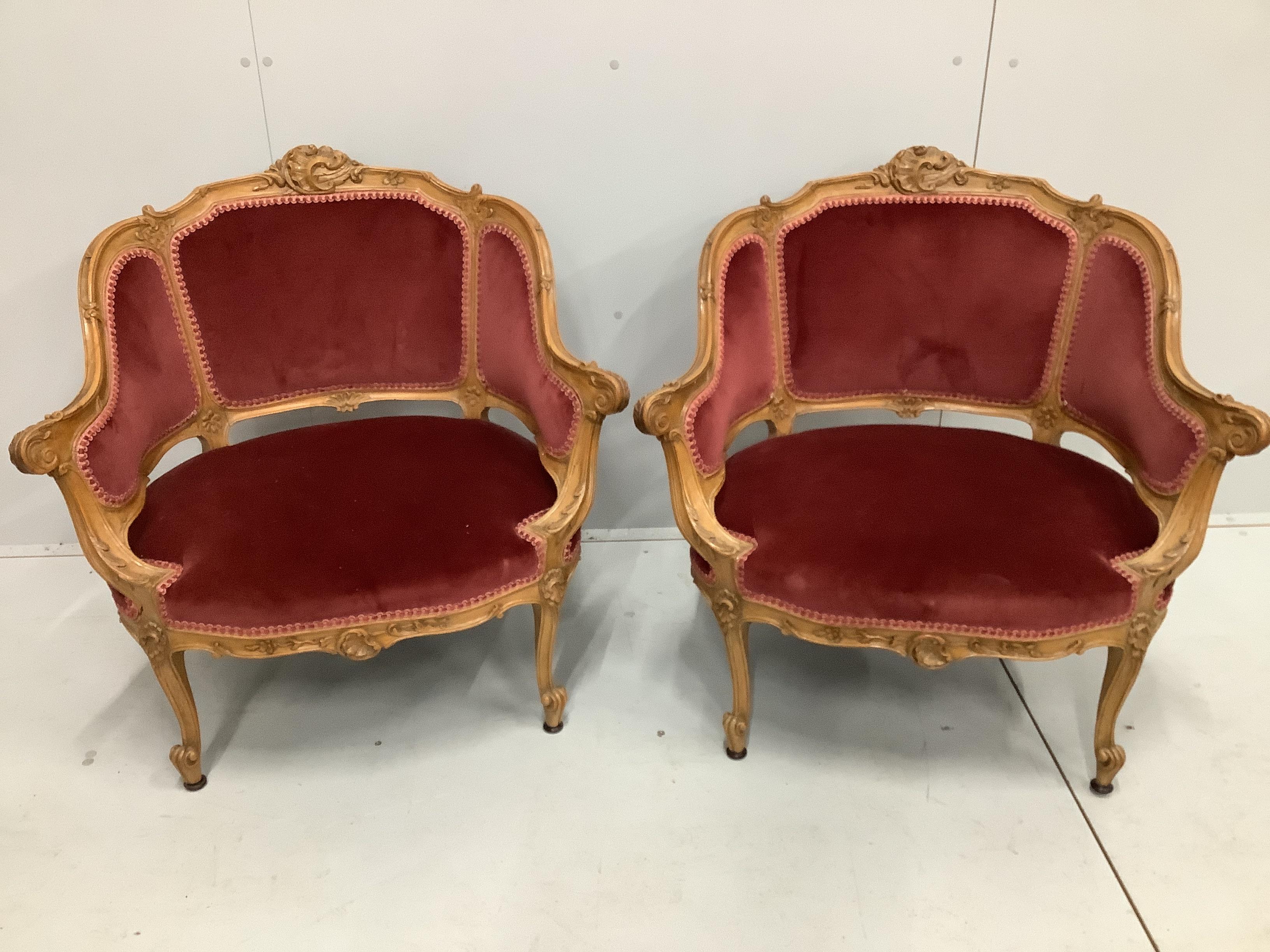 A pair of late 19th / early 20th century French carved beech fauteuils, width 80cm, depth 62cm, height 79cm